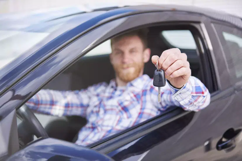 guy enjoying new car